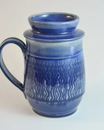 handmade travel mug with tea strainer, engraved, dark blue glazed