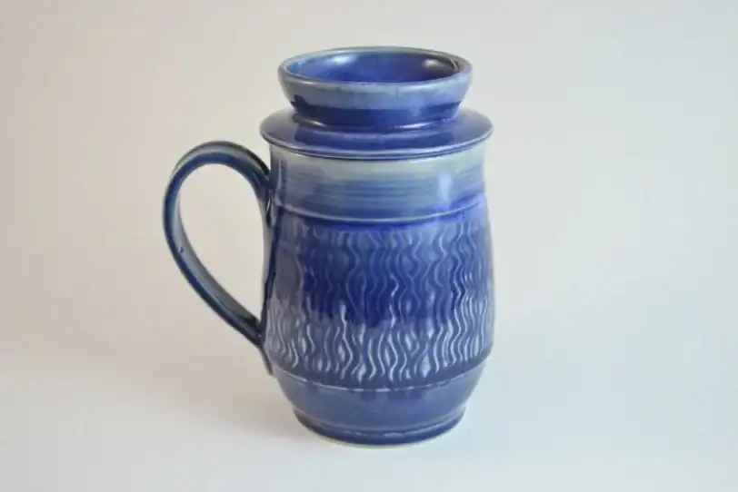 handmade travel mug with tea strainer, engraved, dark blue glazed