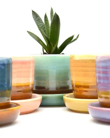 colorful ceramic travel mug with drainage and saucer